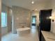 Luxurious bathroom with freestanding tub, large shower, and elegant vanity at 4311 W Sevilla St, Tampa, FL 33629