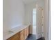 Bathroom featuring a double vanity with quartz countertop and modern fixtures at 4311 W Sevilla St, Tampa, FL 33629