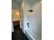 White subway tile surrounds the shower and bath in this stylish bathroom at 4311 W Sevilla St, Tampa, FL 33629