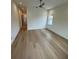 Inviting bedroom featuring hardwood floors, a ceiling fan, and a window offering a serene outdoor view at 4311 W Sevilla St, Tampa, FL 33629
