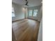 Well-lit bedroom with hardwood floors, neutral walls, and multiple windows for abundant natural light at 4311 W Sevilla St, Tampa, FL 33629