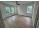Bright bedroom with hardwood floors, recessed lighting, and multiple windows at 4311 W Sevilla St, Tampa, FL 33629