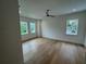 Bright bedroom with hardwood floors, recessed lighting, and multiple windows at 4311 W Sevilla St, Tampa, FL 33629