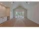 Bright bonus room boasts vaulted ceilings, neutral carpet, wet bar, and access to patio at 4311 W Sevilla St, Tampa, FL 33629