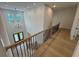 Bright foyer with a modern chandelier, wood floors, and a staircase with metal spindles at 4311 W Sevilla St, Tampa, FL 33629