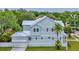 View of the house displaying the metal roof, garage, and side yard at 4311 W Sevilla St, Tampa, FL 33629