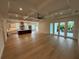Bright, open-concept living room and kitchen with hardwood floors and coffered ceiling at 4311 W Sevilla St, Tampa, FL 33629