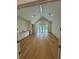 Spacious living room with vaulted ceilings, recessed lighting, built-in cabinets, and access to the outdoor patio at 4311 W Sevilla St, Tampa, FL 33629