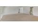 Spacious living room with neutral carpet and white walls, ready for personalization at 4311 W Sevilla St, Tampa, FL 33629