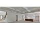 Open-concept living area with coffered ceilings, white walls, and a kitchen island at 4311 W Sevilla St, Tampa, FL 33629