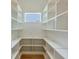 Walk-in pantry features custom shelving for maximum storage and organization at 4311 W Sevilla St, Tampa, FL 33629