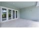 Spacious outdoor patio features elegant tile flooring and large glass doors with natural light at 4311 W Sevilla St, Tampa, FL 33629