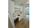 Stylish wet bar with marble countertop, white cabinets, and a sink at 4311 W Sevilla St, Tampa, FL 33629