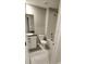 This bathroom features tiled floors, granite counters, and a shower and tub combo at 4505 Globe Thistle Dr, Tampa, FL 33619