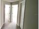 Hallway has neutral-toned walls and plush carpet flooring at 4505 Globe Thistle Dr, Tampa, FL 33619