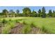 This outdoor park features a beautiful green lawn and shaded bench at 4505 Globe Thistle Dr, Tampa, FL 33619