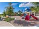 This community playground features a colorful jungle gym and area to play at 4505 Globe Thistle Dr, Tampa, FL 33619