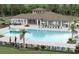 This community pool offers a spacious area to enjoy the sun and is surrounded by palm trees at 4505 Globe Thistle Dr, Tampa, FL 33619