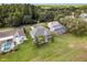 Expansive aerial view of the home, highlighting the large yard, screened pool, and surrounding lush greenery at 4508 Netherwood Dr, Tampa, FL 33624