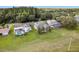 Aerial view of backyard pools, lush lawns, and mature landscaping at 4508 Netherwood Dr, Tampa, FL 33624