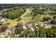 Beautiful aerial view of home nestled on a golf course, showcasing its well-maintained landscaping and nearby pond at 4508 Netherwood Dr, Tampa, FL 33624