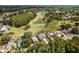 Stunning aerial view of a golf course community with lush landscaping, serene lakes, and beautiful homes at 4508 Netherwood Dr, Tampa, FL 33624