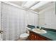 Bathroom featuring a shower with patterned curtain and a vanity at 4508 Netherwood Dr, Tampa, FL 33624