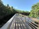 Scenic community boardwalk offers a tranquil escape amidst lush greenery and serene water views at 4508 Netherwood Dr, Tampa, FL 33624