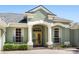 Charming home featuring a welcoming front entrance with stylish columns, double doors, and manicured landscaping at 4508 Netherwood Dr, Tampa, FL 33624