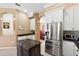 Well-equipped kitchen with stainless steel appliances, white cabinetry, and an island at 4508 Netherwood Dr, Tampa, FL 33624