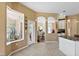 Bright kitchen with tiled floors, breakfast bar, modern appliances, and view to adjacent living area at 4508 Netherwood Dr, Tampa, FL 33624