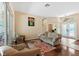 Cozy living room featuring hardwood floors, neutral paint, and an inviting seating area with natural light at 4508 Netherwood Dr, Tampa, FL 33624