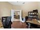 Home office with hardwood floors, neutral paint, and open doorway to living space at 4508 Netherwood Dr, Tampa, FL 33624