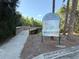 Scenic view of the Northdale Lake Park Trail featuring a wooden bridge and information sign at 4508 Netherwood Dr, Tampa, FL 33624