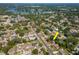 A tranquil neighborhood with tree-lined streets and a nearby lake, perfect for relaxation and outdoor activities at 4706 E Sligh Ave, Tampa, FL 33610