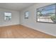 Well-lit bedroom with tile flooring and two windows providing ample natural light at 4706 E Sligh Ave, Tampa, FL 33610