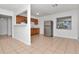 Kitchen featuring wooden cabinets, stainless steel appliances, and neutral tile flooring at 4706 E Sligh Ave, Tampa, FL 33610