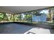 Spacious screened-in patio providing a great outdoor living area for relaxation and entertainment at 4706 E Sligh Ave, Tampa, FL 33610
