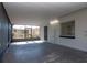 Screened in patio with solid roof, lighting, access to yard and exterior door to house at 4706 E Sligh Ave, Tampa, FL 33610