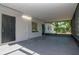 The covered and screened outdoor space is perfect for relaxing and enjoying the backyard at 4706 E Sligh Ave, Tampa, FL 33610