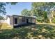Spacious screened-in porch offers a relaxing outdoor living space with access to the backyard at 4706 E Sligh Ave, Tampa, FL 33610