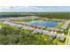 Aerial view of the home with a red pin, a lake, and the surrounding community at 5026 Bromeliad Ave, Wimauma, FL 33598