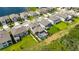 Aerial view of neighborhood homes with a backyard pool and manicured lawns at 5026 Bromeliad Ave, Wimauma, FL 33598