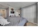 This bedroom has neutral walls, a ceiling fan, and double closets at 5026 Bromeliad Ave, Wimauma, FL 33598