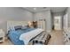 Comfortable bedroom featuring a queen bed, large window, and neutral tones for a peaceful atmosphere at 5026 Bromeliad Ave, Wimauma, FL 33598