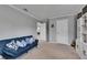 Bonus room with soft carpet, neutral colors, and comfortable seating, providing ample relaxation space at 5026 Bromeliad Ave, Wimauma, FL 33598
