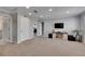 Spacious bonus room with neutral paint, carpet, recessed lighting, and crown molding at 5026 Bromeliad Ave, Wimauma, FL 33598