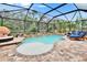 Screened in pool with a patio and many chairs for enjoying the sun and warm weather at 5026 Bromeliad Ave, Wimauma, FL 33598