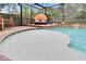 Enclosed pool area featuring a sun bed, patio and clear water at 5026 Bromeliad Ave, Wimauma, FL 33598