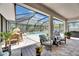 Covered patio with view of pool and seating at 5026 Bromeliad Ave, Wimauma, FL 33598